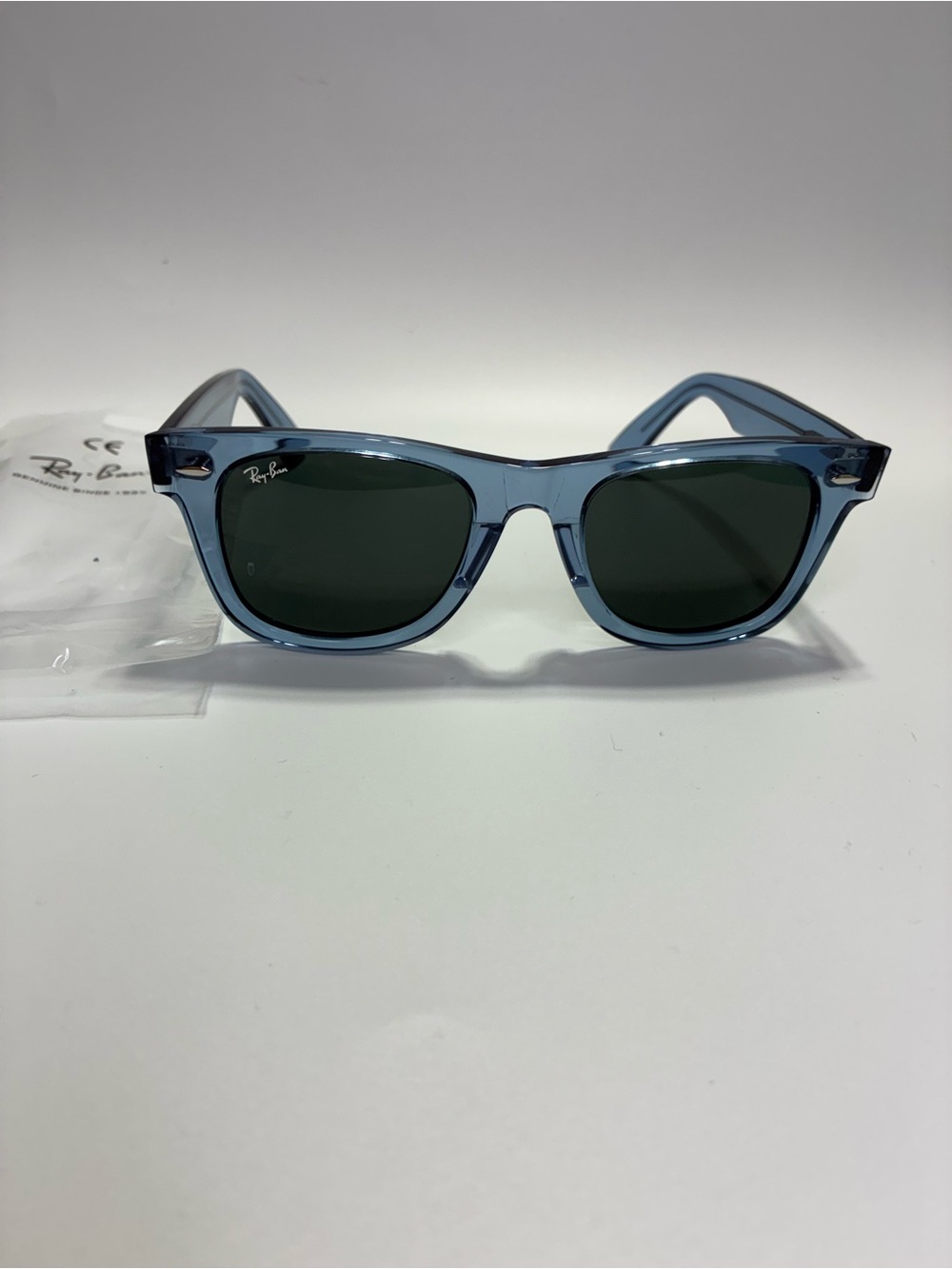 Ray-Ban Blue Transparent Frame Sunglasses with Dark Green Lenses